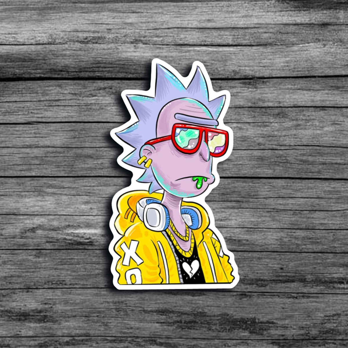 A sticker of Rick from the Animated Series *Rick & Morty*, wearing a yellow hoodie, headphones (around his neck), and red sunglasses