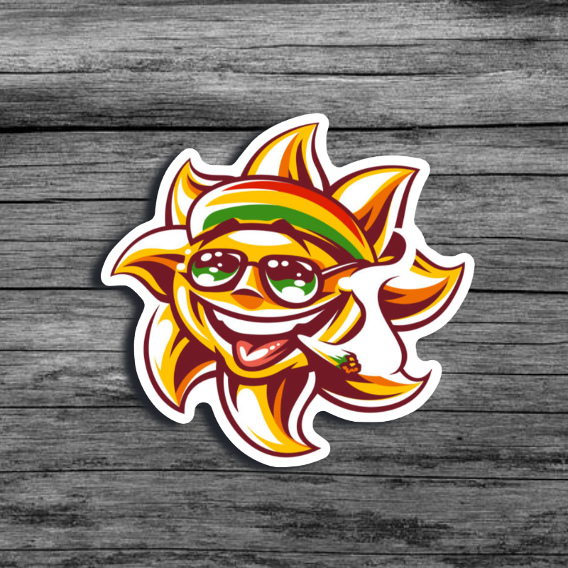 Cartoon sun with a smiling face, with a joint in its mouth, wearing a Jamaican colored headband and sunglasses