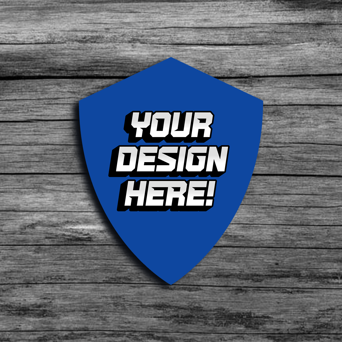 An image of a blue badge shaped template that says"Your Design Here!"