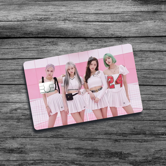 A credit card skin featuring K-pop group Black Pink with 4 women wearing skirts and sporty tops, in front of a multi-shaded pink background.