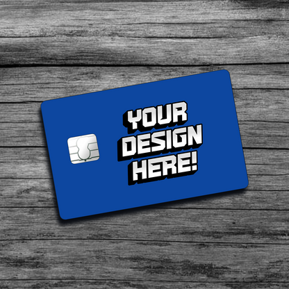 A picture of a blue personalized credit card skin that says "Your Design Here", with a big chip on the left side