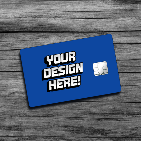 A picture of a blue personalized credit card skin that says "Your Design Here", with a big chip on the right side