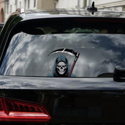 Grim Reaper decal on a car window with a cityscape background