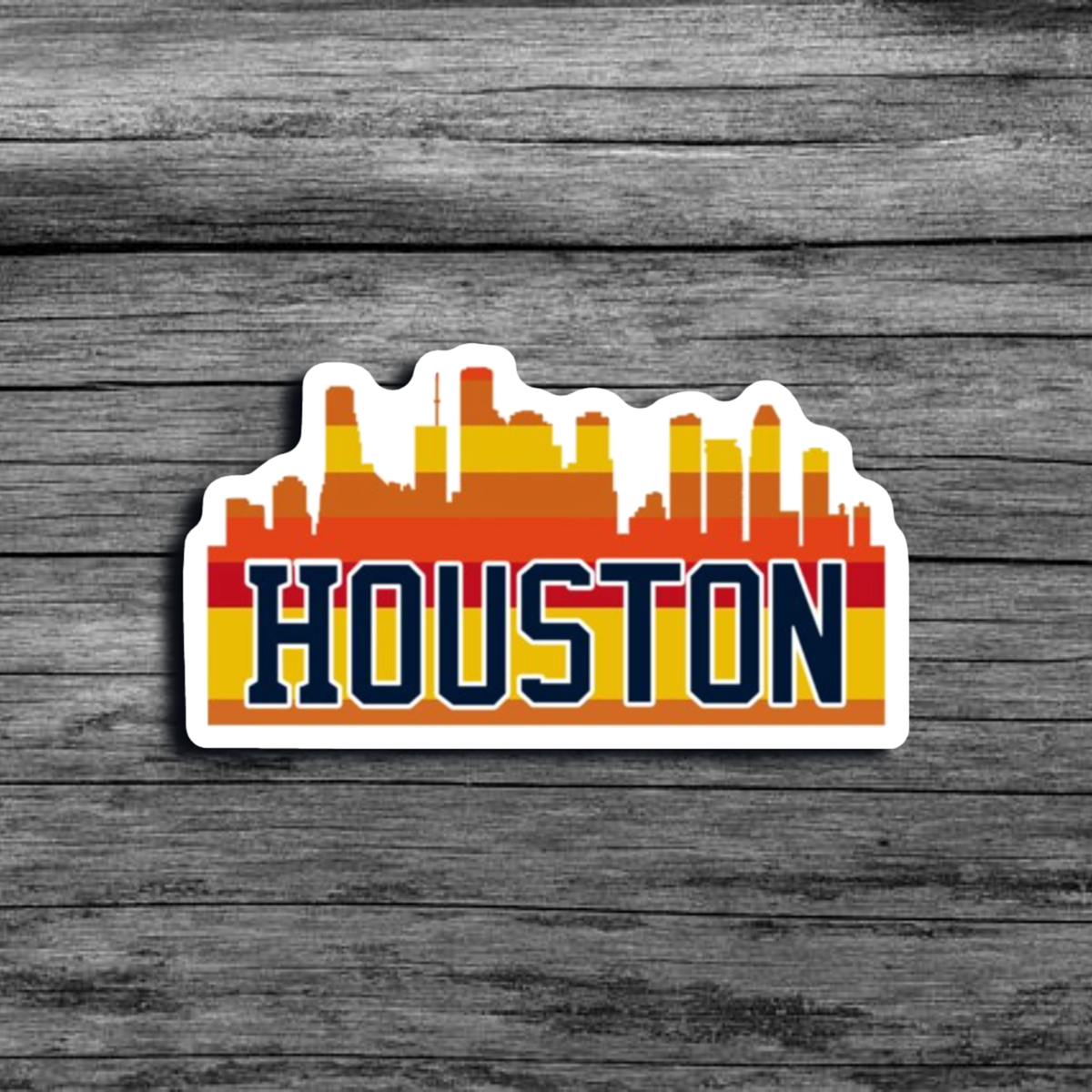 A sticker of the Houston, TX city skyline, with an orange and yellow color scheme, with the word "Houston"