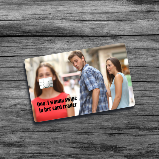 A credit card skin featuring the Love Triangle meme: a man looking at another woman while his girlfriend looks on disapprovingly, illustrating romantic conflict.