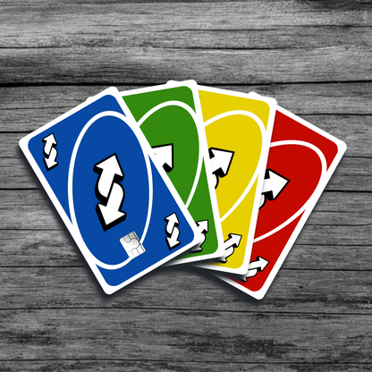 A group of credit card skins featuring the UNO reverse card: a bold design in all four original colors and a prominent twisted double-sided white arrow symbol.