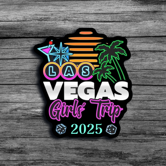 A sticker of a vibrant sign saying "Las Vegas Girls Trip 2025", with palm trees, a martini glass, and sunset