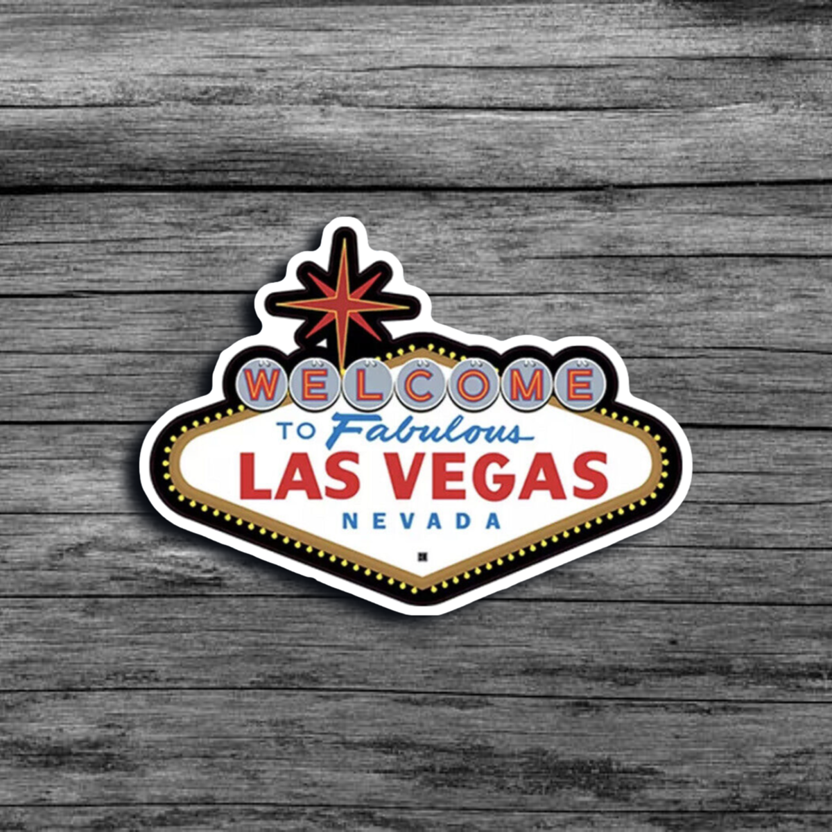 A sticker of the iconic *Welcome to Las Vegas* sign