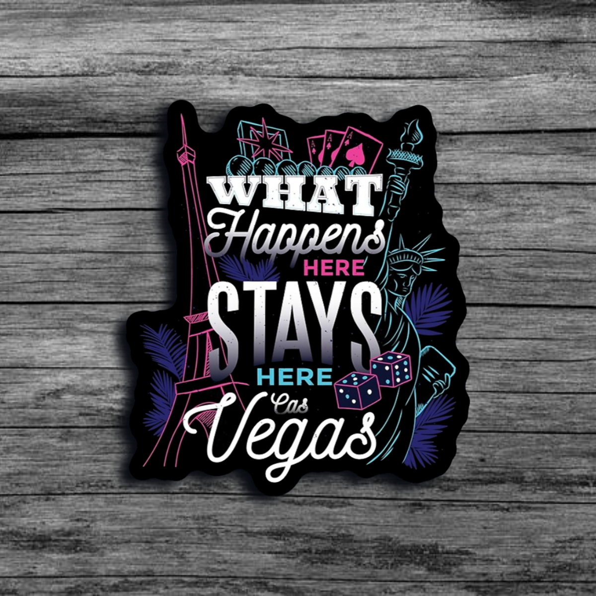 A sticker that says "What Happens Here Stays Here - Las Vegas", with neon details and images related to gambling, Paris, and the Statue of Liberty